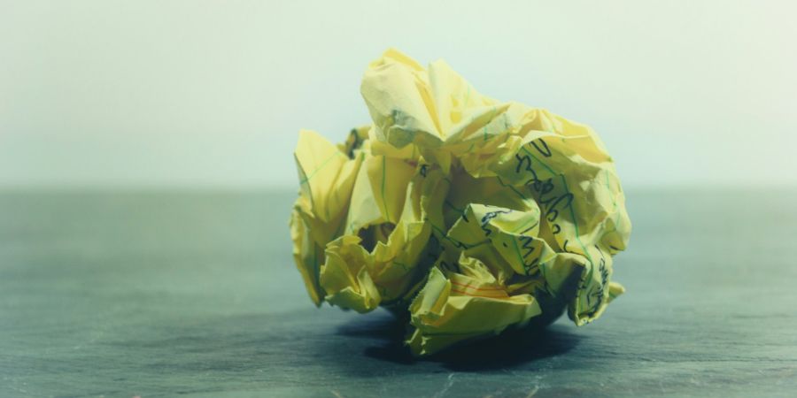 paper crumpled up into a trash ball, indoors