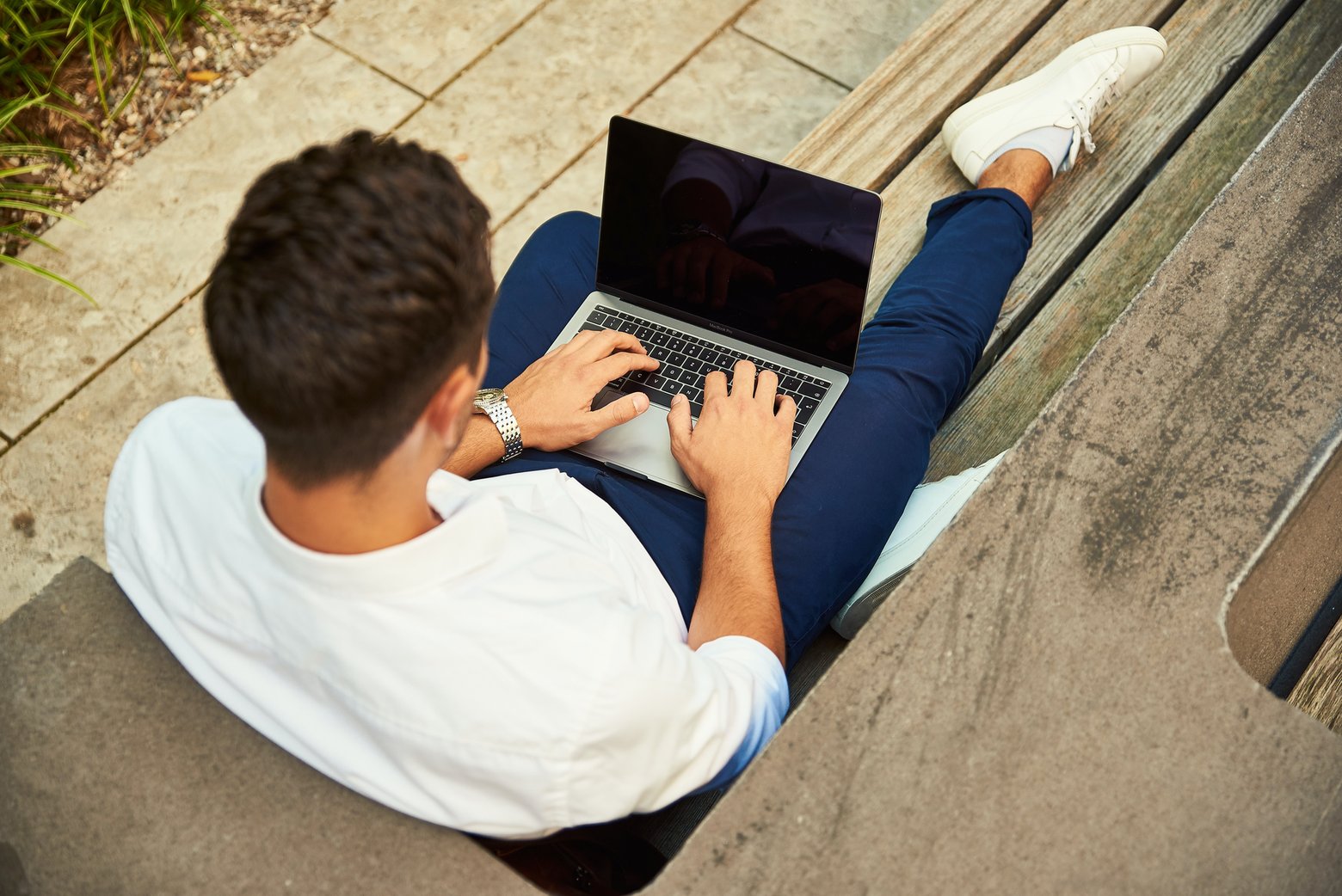 man outdoors using computer