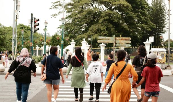 a group of people crossing the street