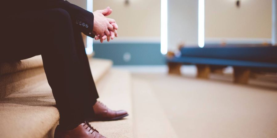 man waiting inside a building