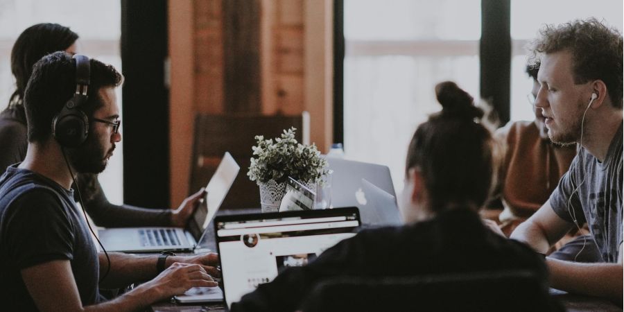 group of people meeting in an office indoors