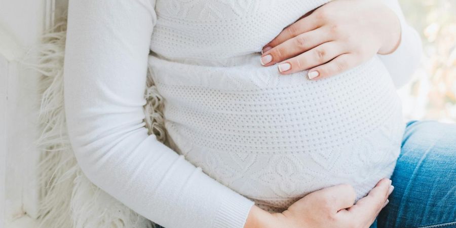 pregnant woman sitting down