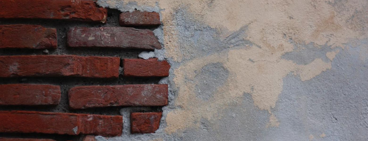 a brick and plaster wall