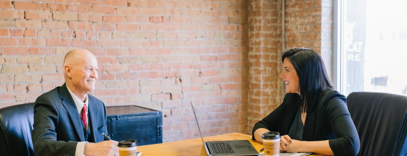 interview between a man and woman indoors