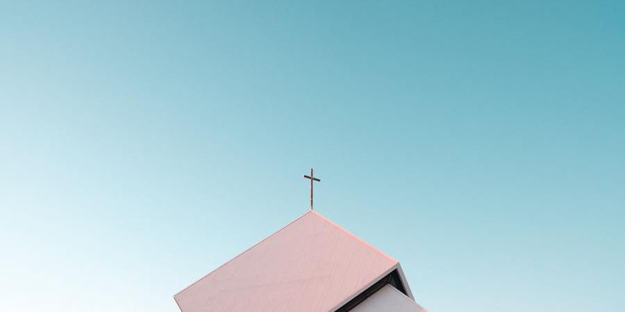 church steeple with a cross, blue sky, outdoors