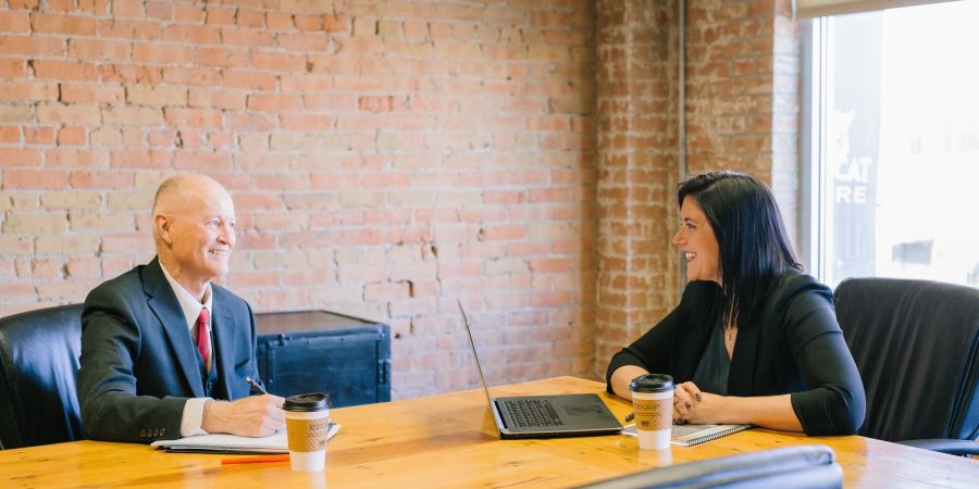 interview between a man and woman indoors