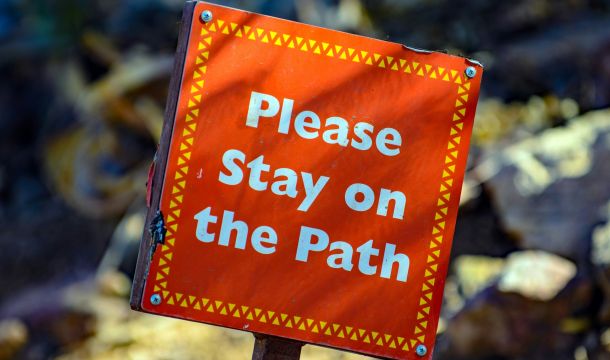 sign: please stay on the path