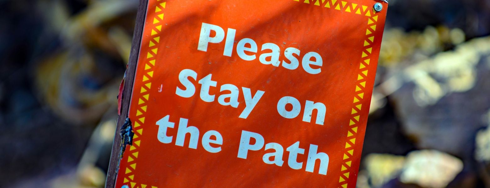 sign: please stay on the path