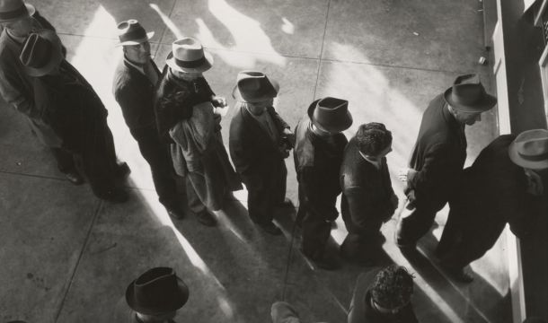 a line of people waiting on employment