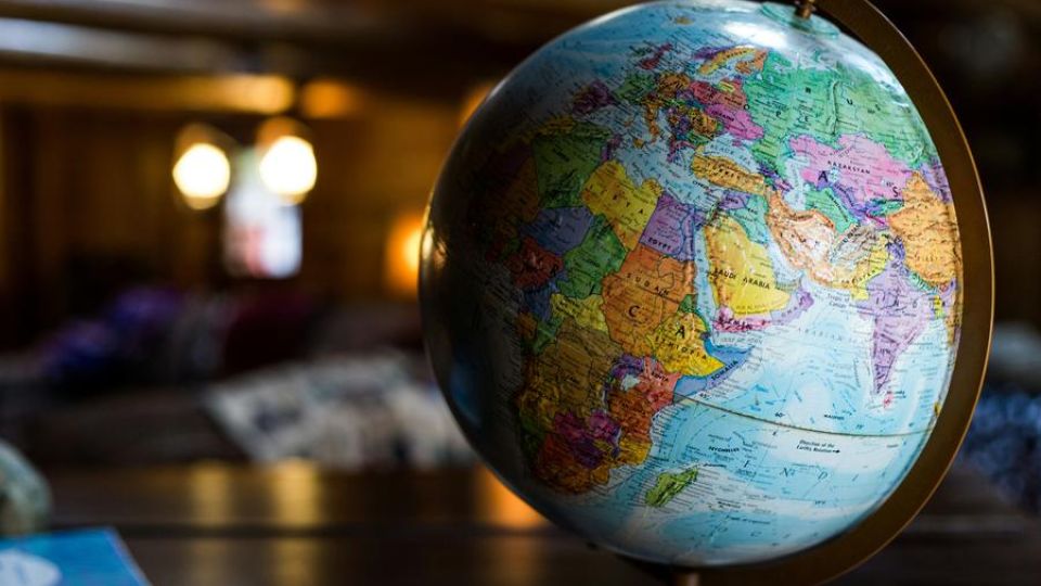 photo of a globe on a table