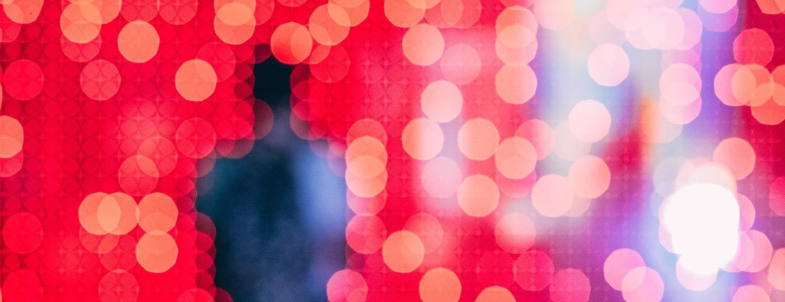 a blurry abstract photo of a person, red background