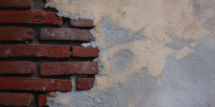 a brick and plaster wall
