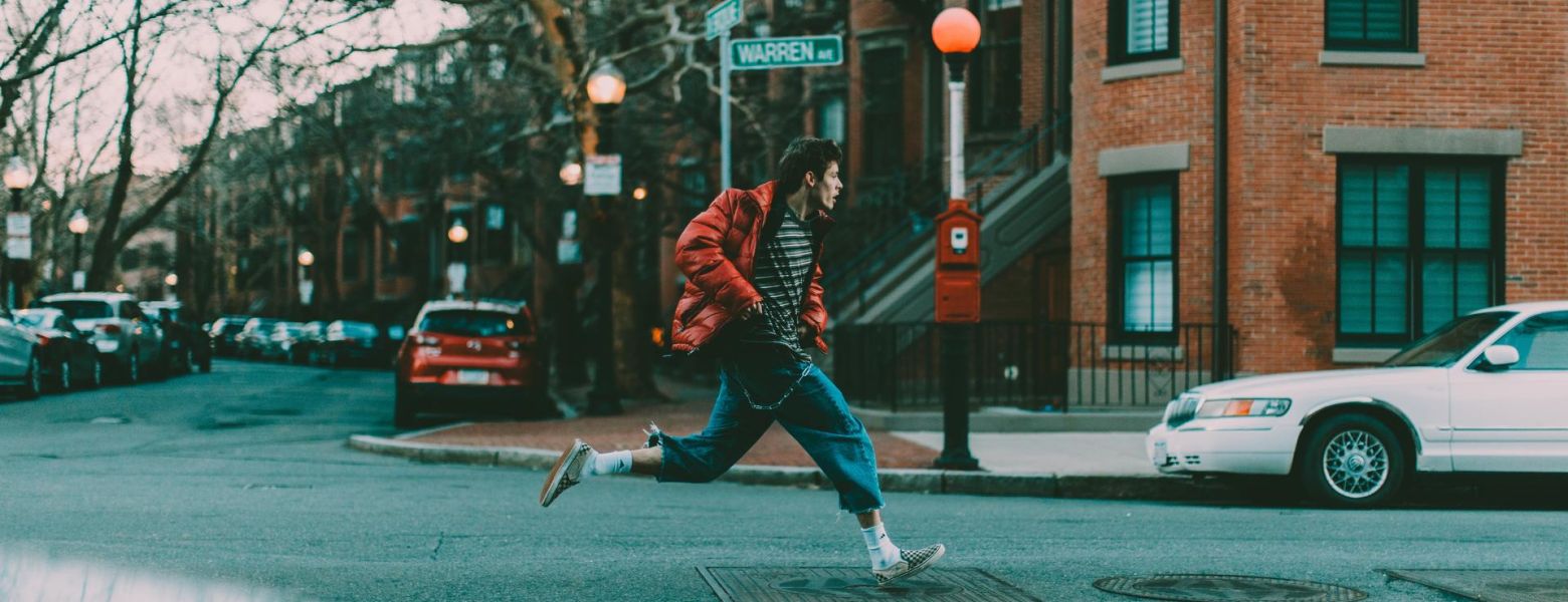 man running outside on street