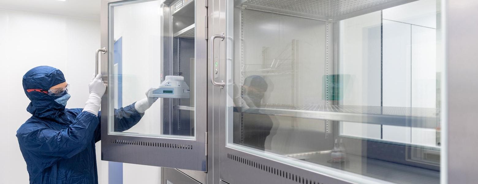 Laboratory technician monitoring environment in lab