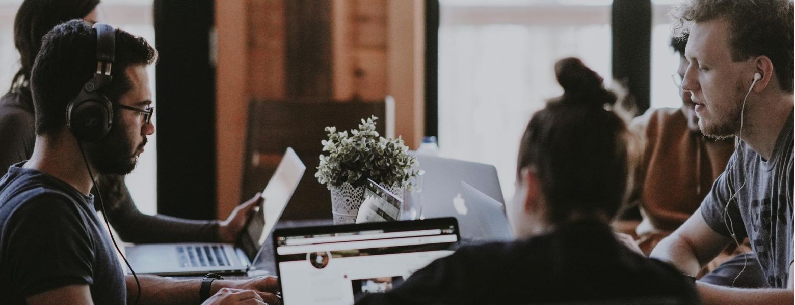 group of people meeting in an office indoors
