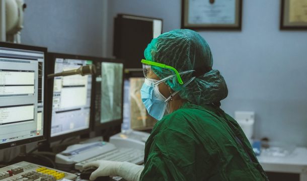 nurse working on a computer inside a hospital