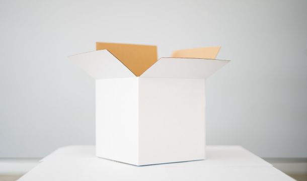box on white table in a white room indoors