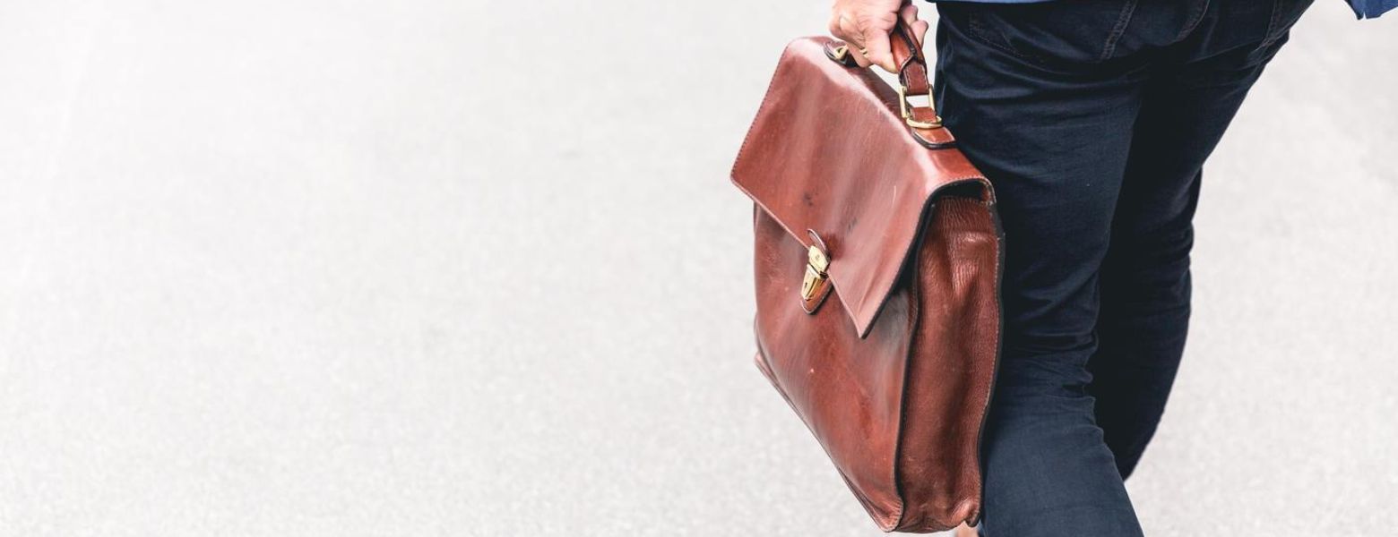man with a leather briefcase