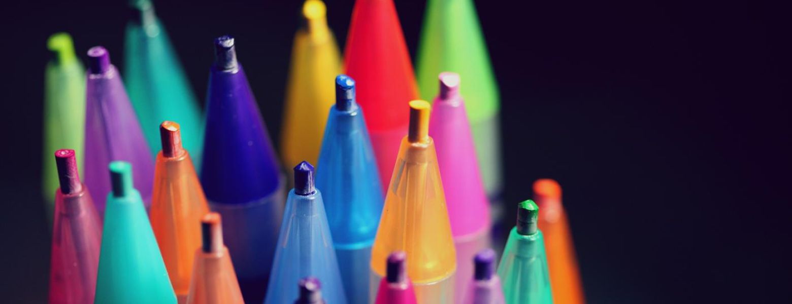 colored pencil tips, on black background