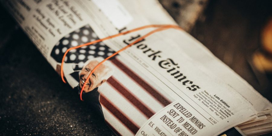 biden, new york times printed paper in a rubber band