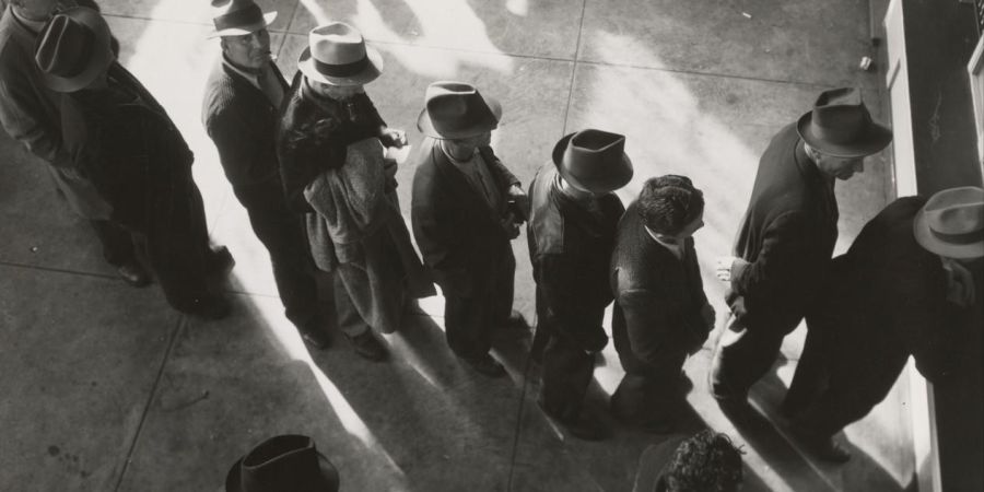 a line of people waiting on employment