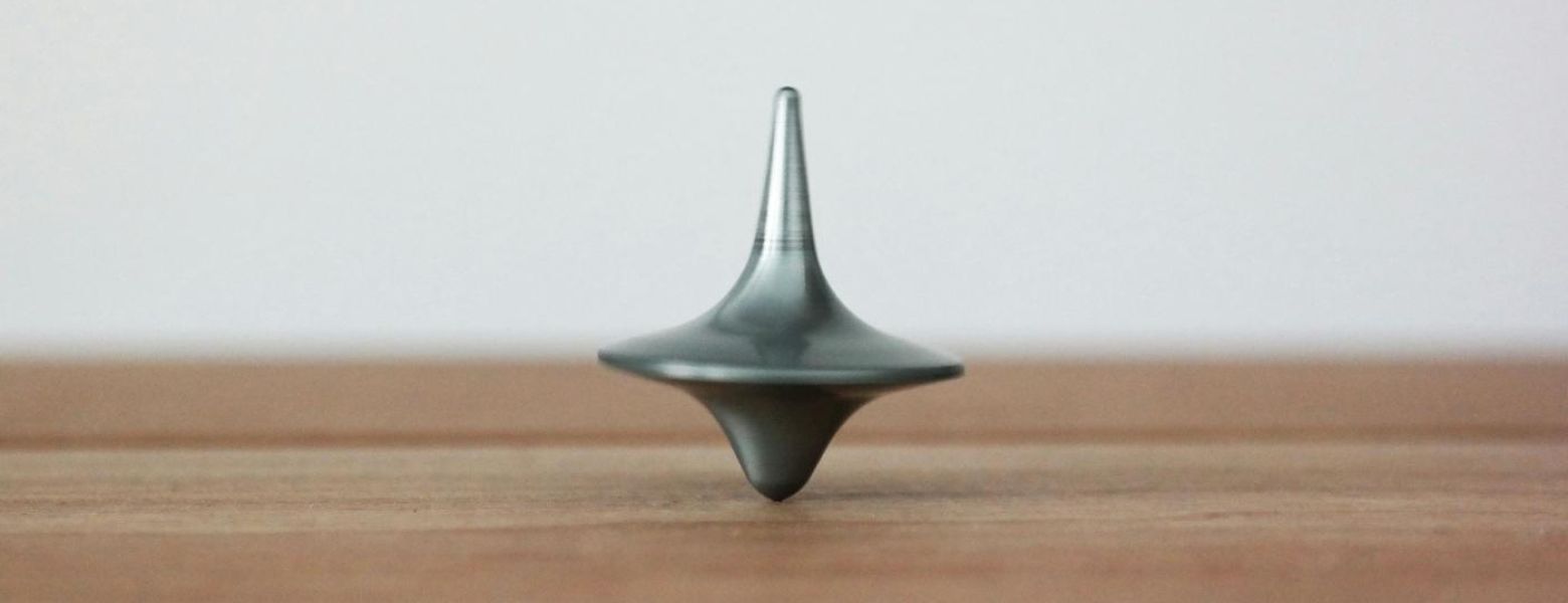 a spinning top on a wooden table