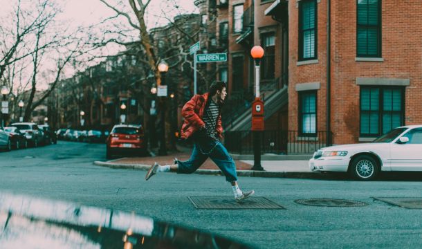 man running outside on street