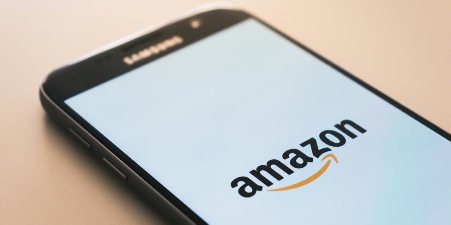 amazon app, mobile phone, table, indoors