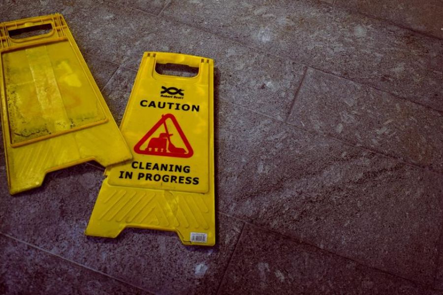 yellow caution cleaning sign, indoors, on the floor