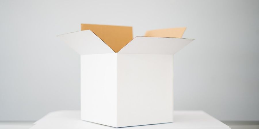 box on white table in a white room indoors