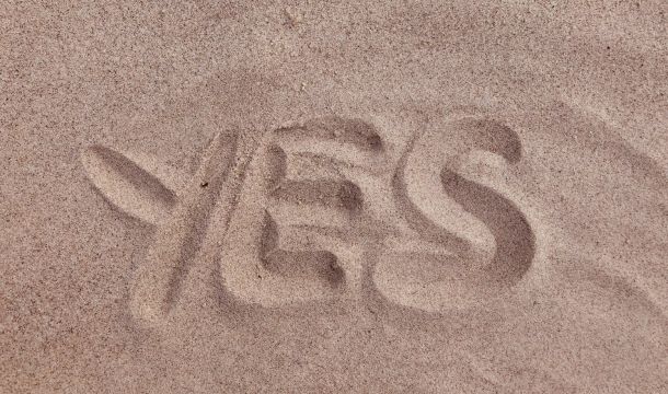 yes written in the sand, outdoors