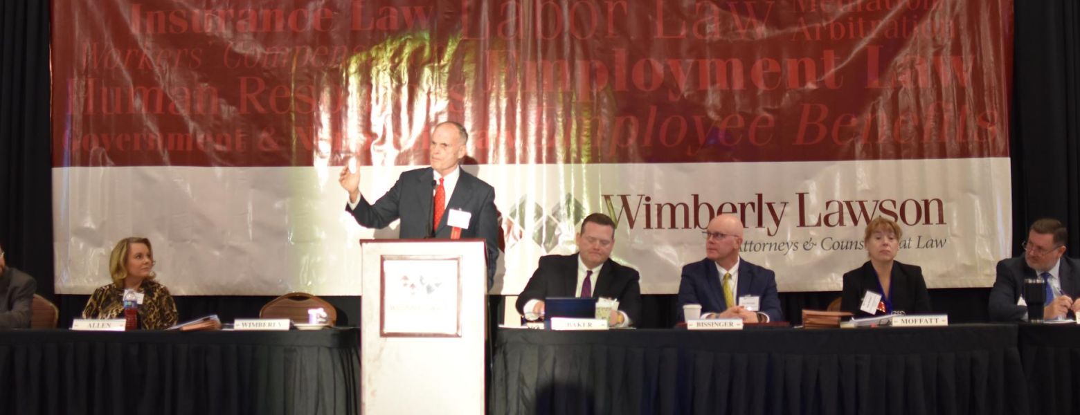 james wimberly presenting at wimlaw conference 2022, indoors