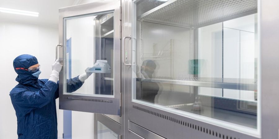 Laboratory technician monitoring environment in lab