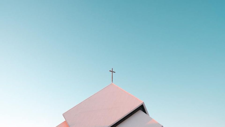 church steeple with a cross, blue sky, outdoors