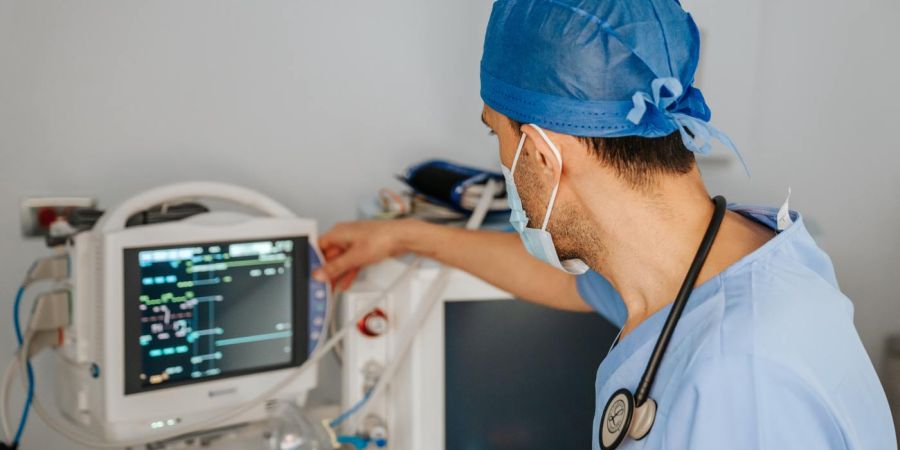 a doctor views vital signs