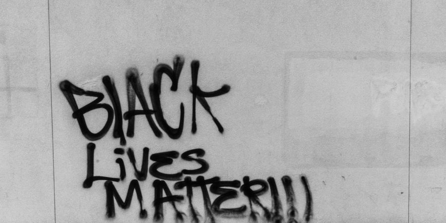 black lives matter painted on a wall