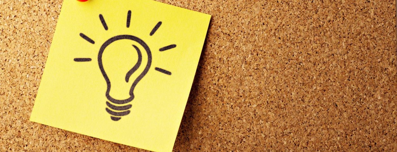 lightbulb sticky note on board