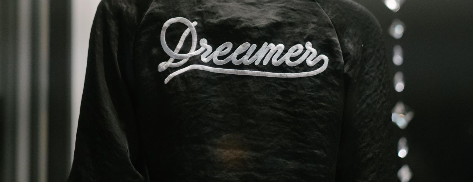 person wearing a dreamer jacket