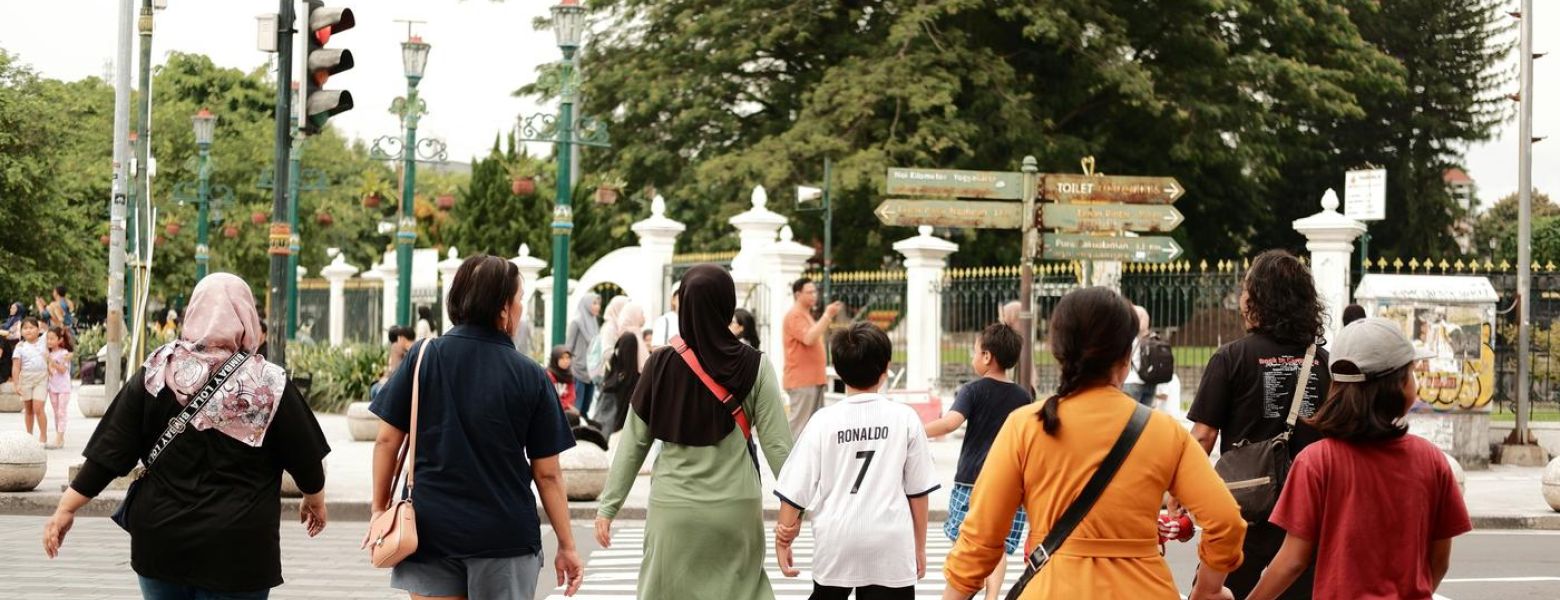 a group of people crossing the street