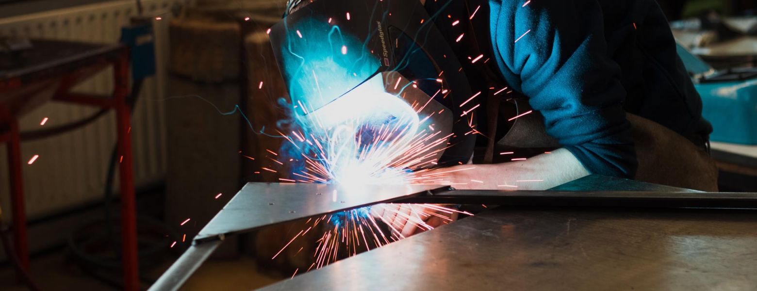 welding metal together, indoors