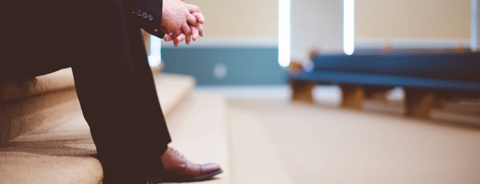 man waiting inside a building