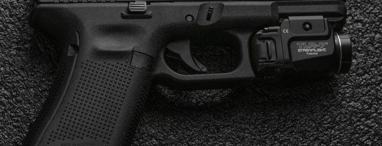 gun laying on its side, indoors