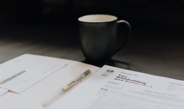 tax papers on a table near a mug