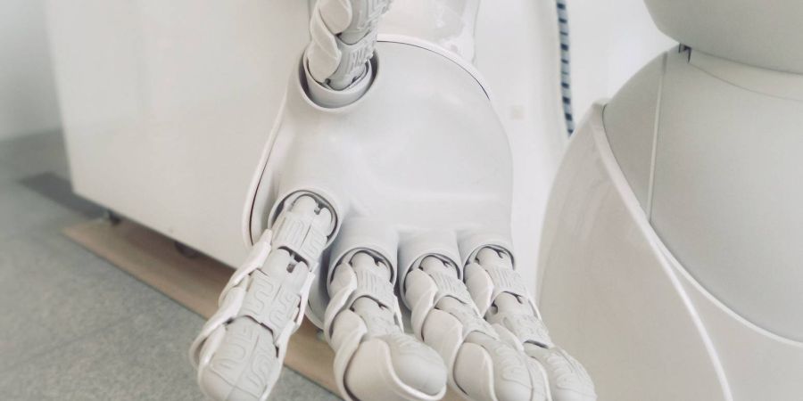 white robot hand, indoors