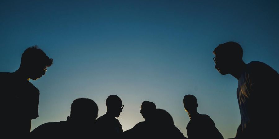 goup of people outdoors, blue sky, Silhouette