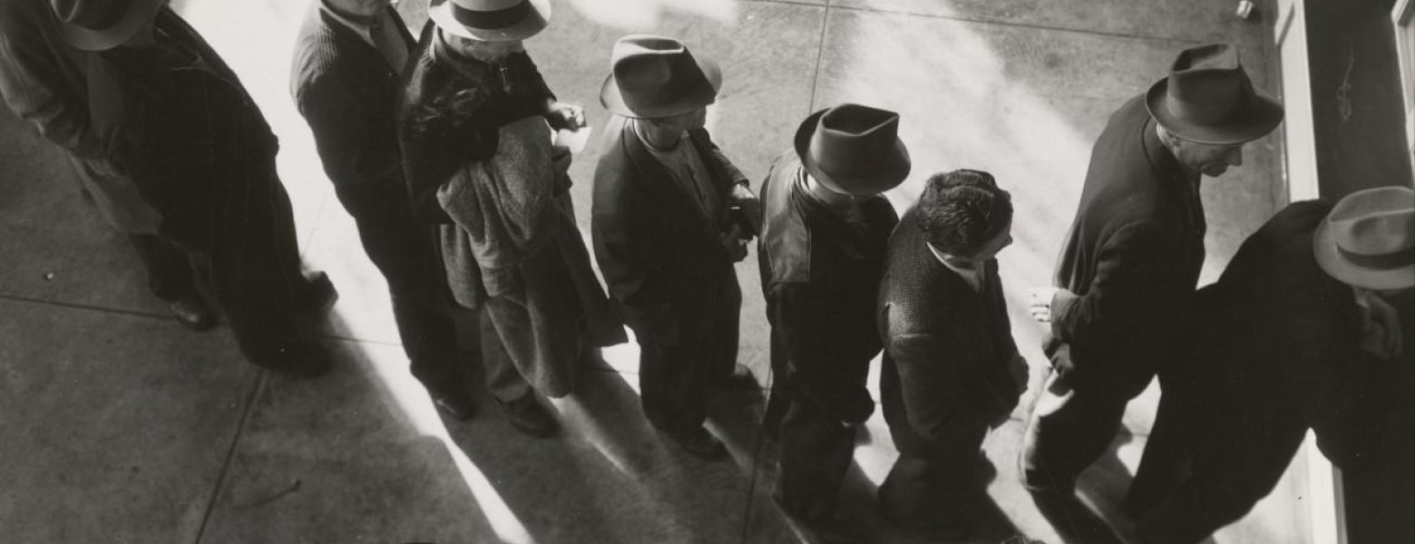 a line of people waiting on employment