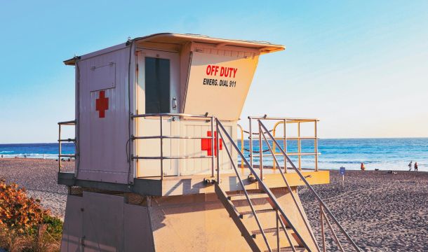 off duty life guard station, beach near ocean, blue sky