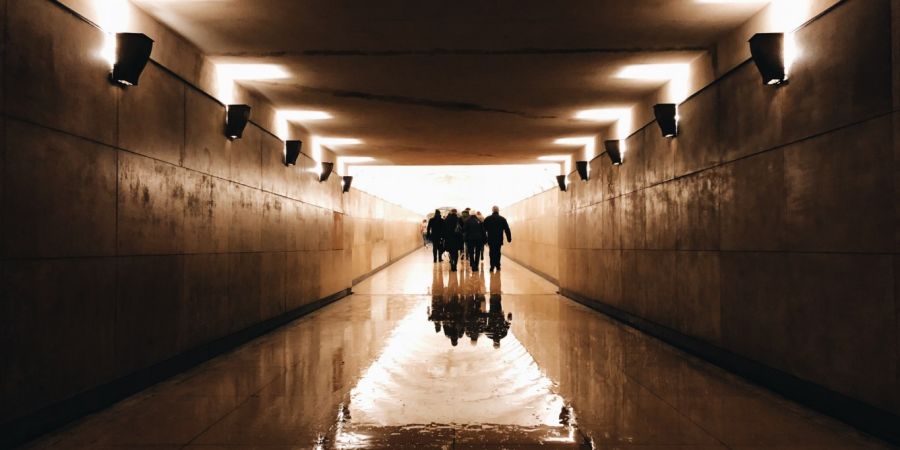 Group walking out of a tunnel