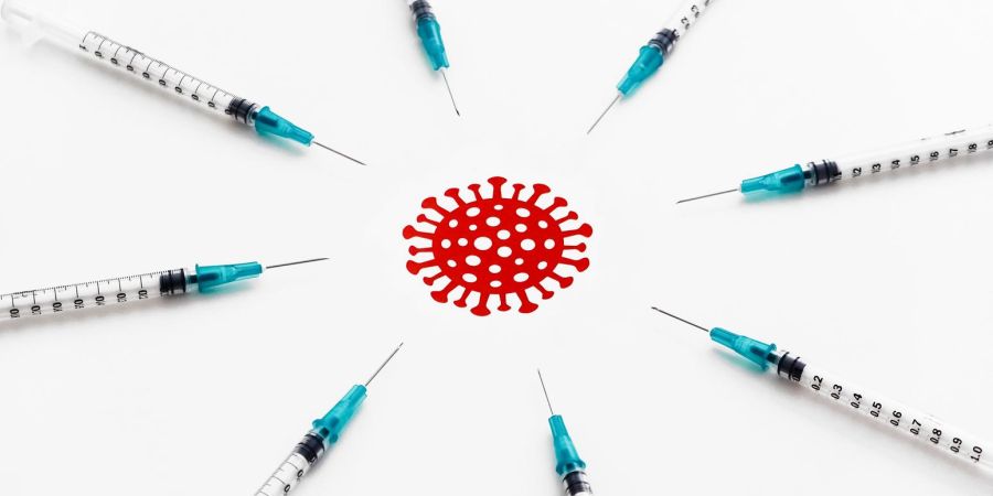 vaccine needles all pointing at red covid virus in the middle