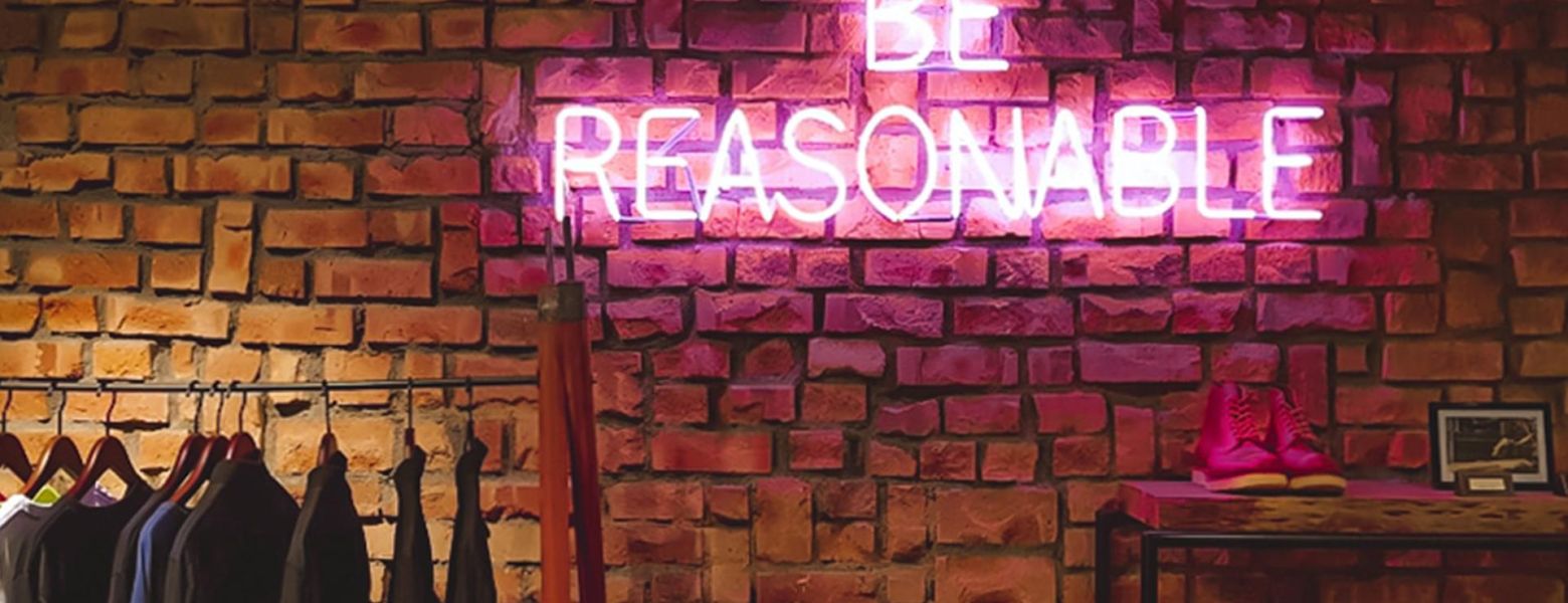 be reasonable, neon sign indoors